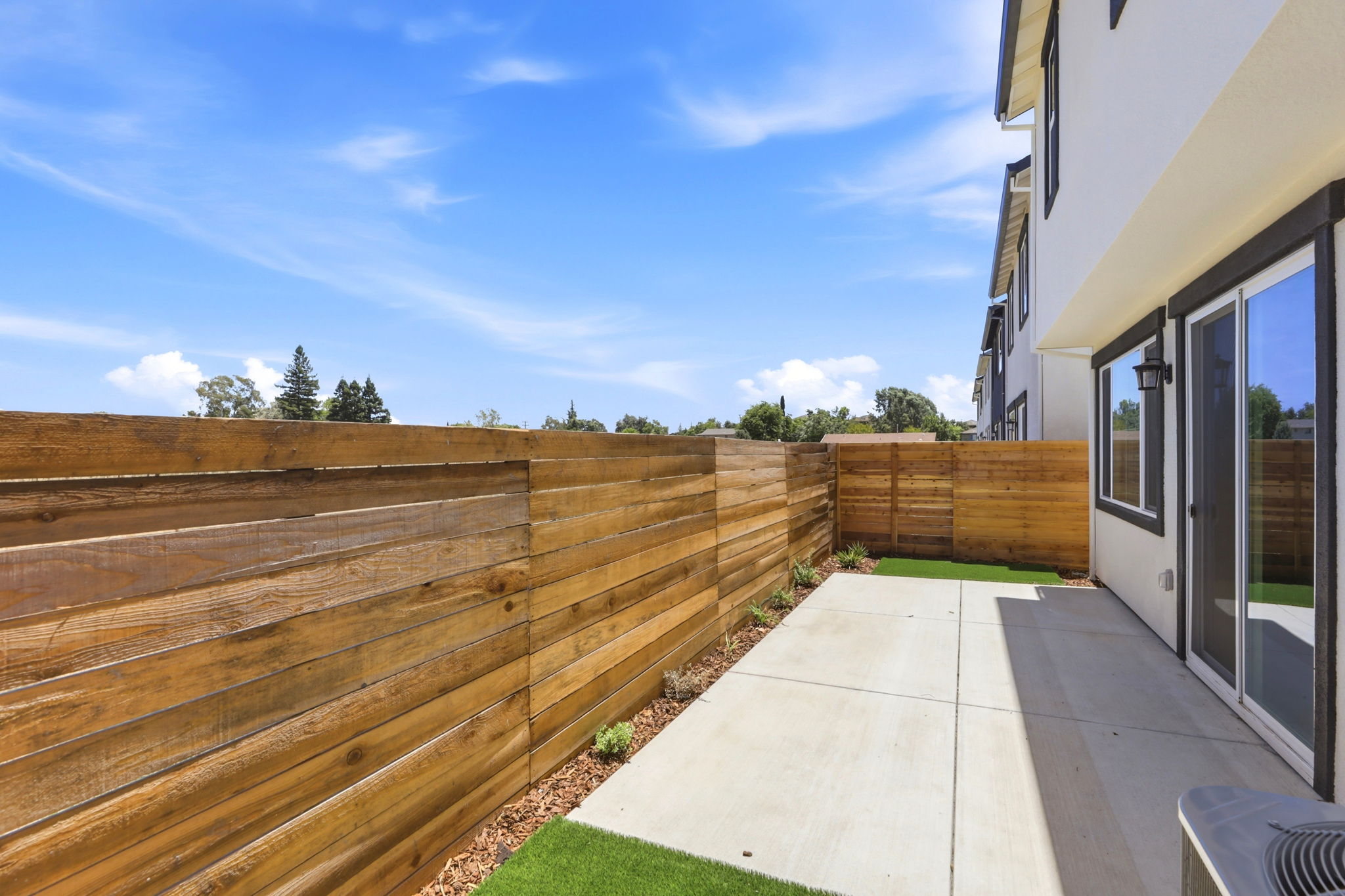 A fenced in backyard.