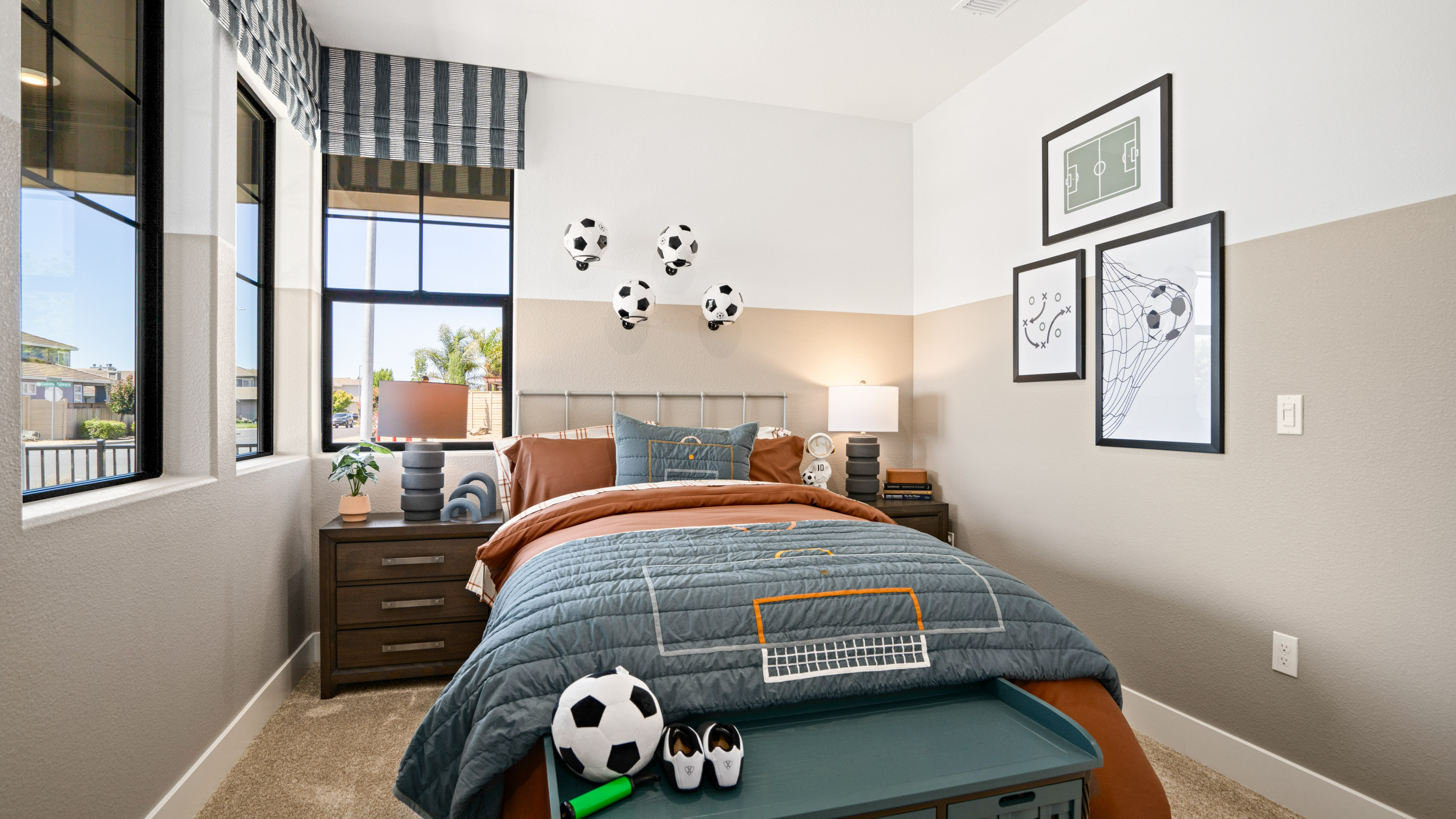 A bedroom with a bed and a window.