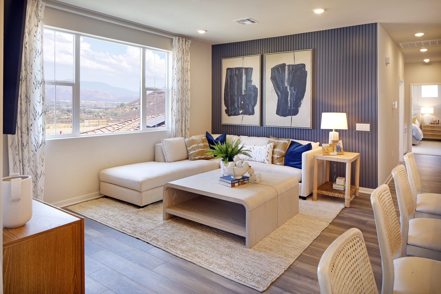A living room with a large window.