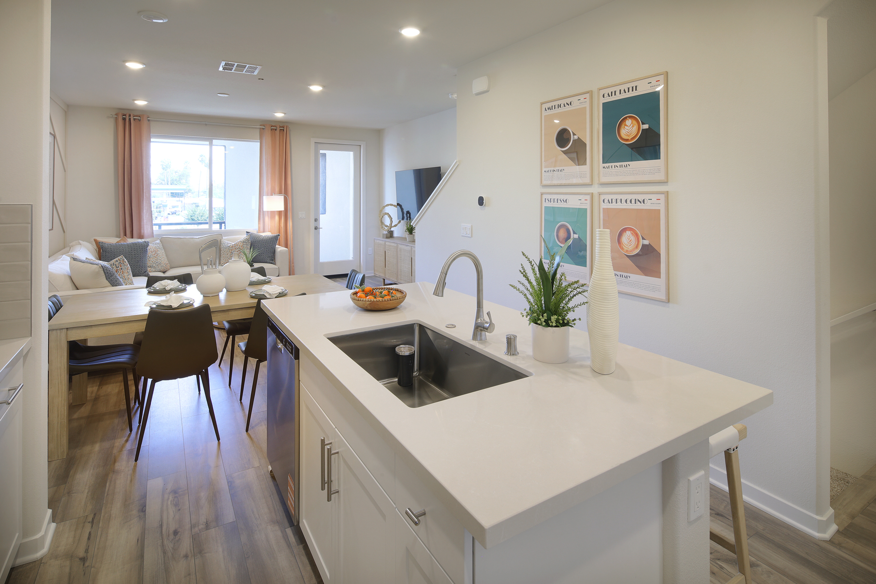 A kitchen with a sink and a table.