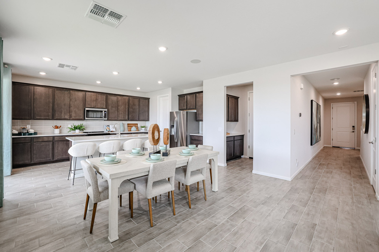 A kitchen with a dining table.