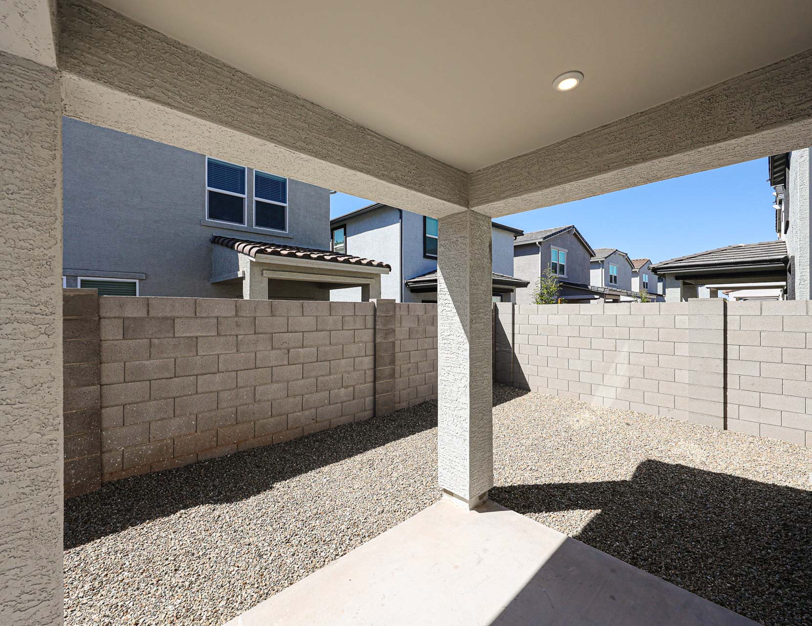 A house with a stone patio.