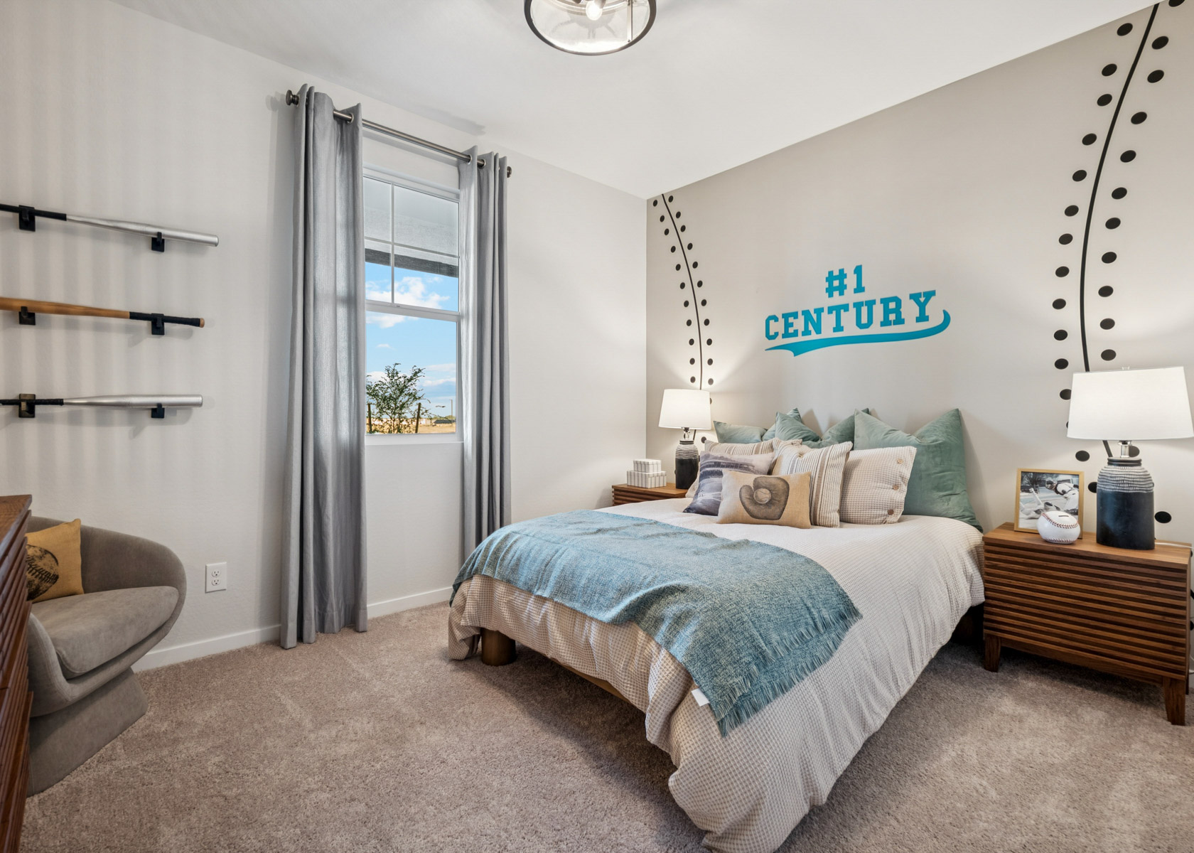 A bedroom with a bed and a chair.