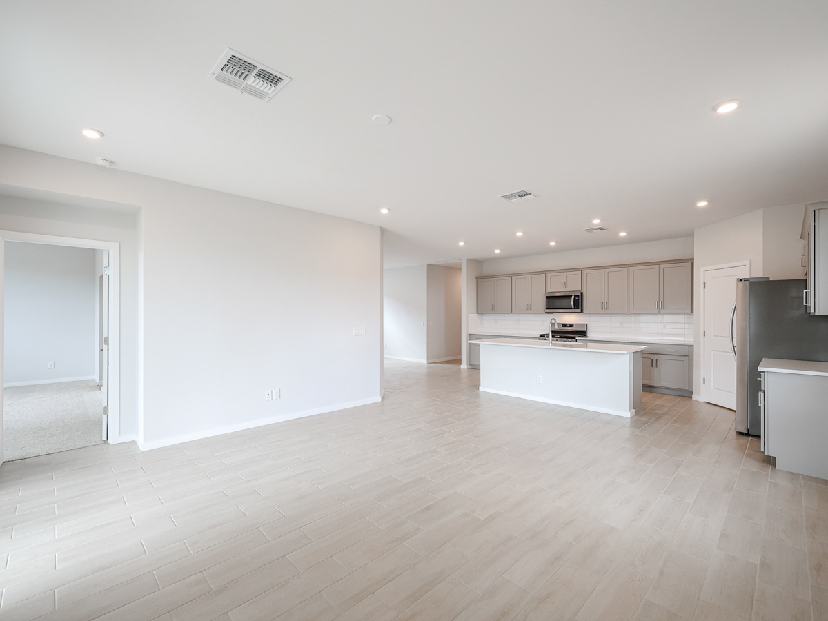 A large kitchen with white cabinets.