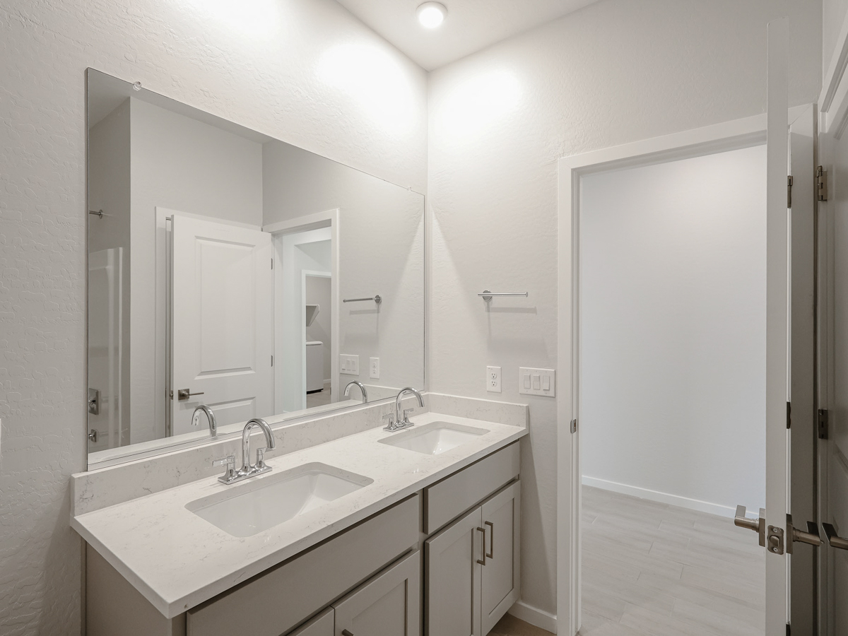 A bathroom with two sinks.