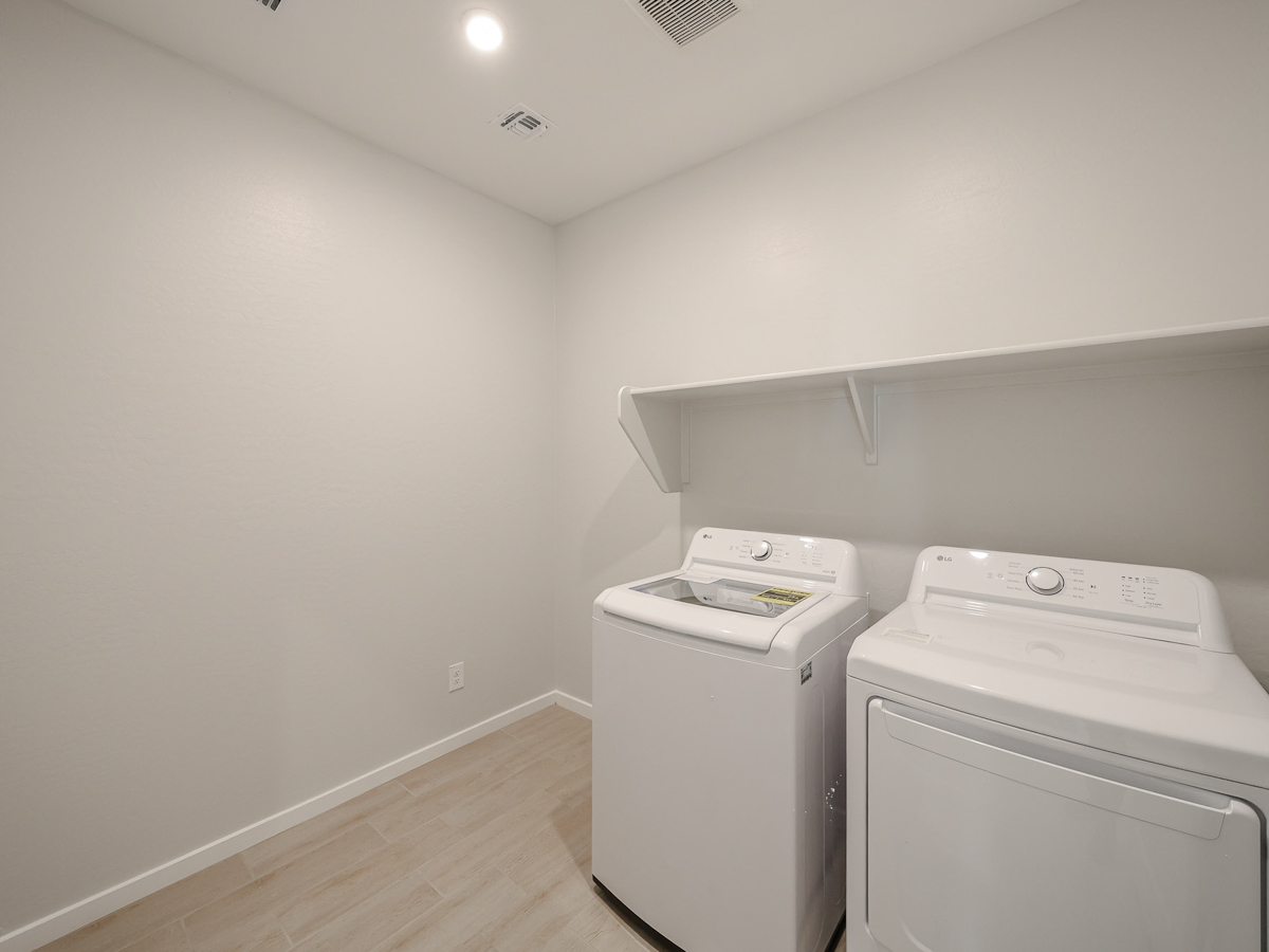A laundry room with a washer and dryer.