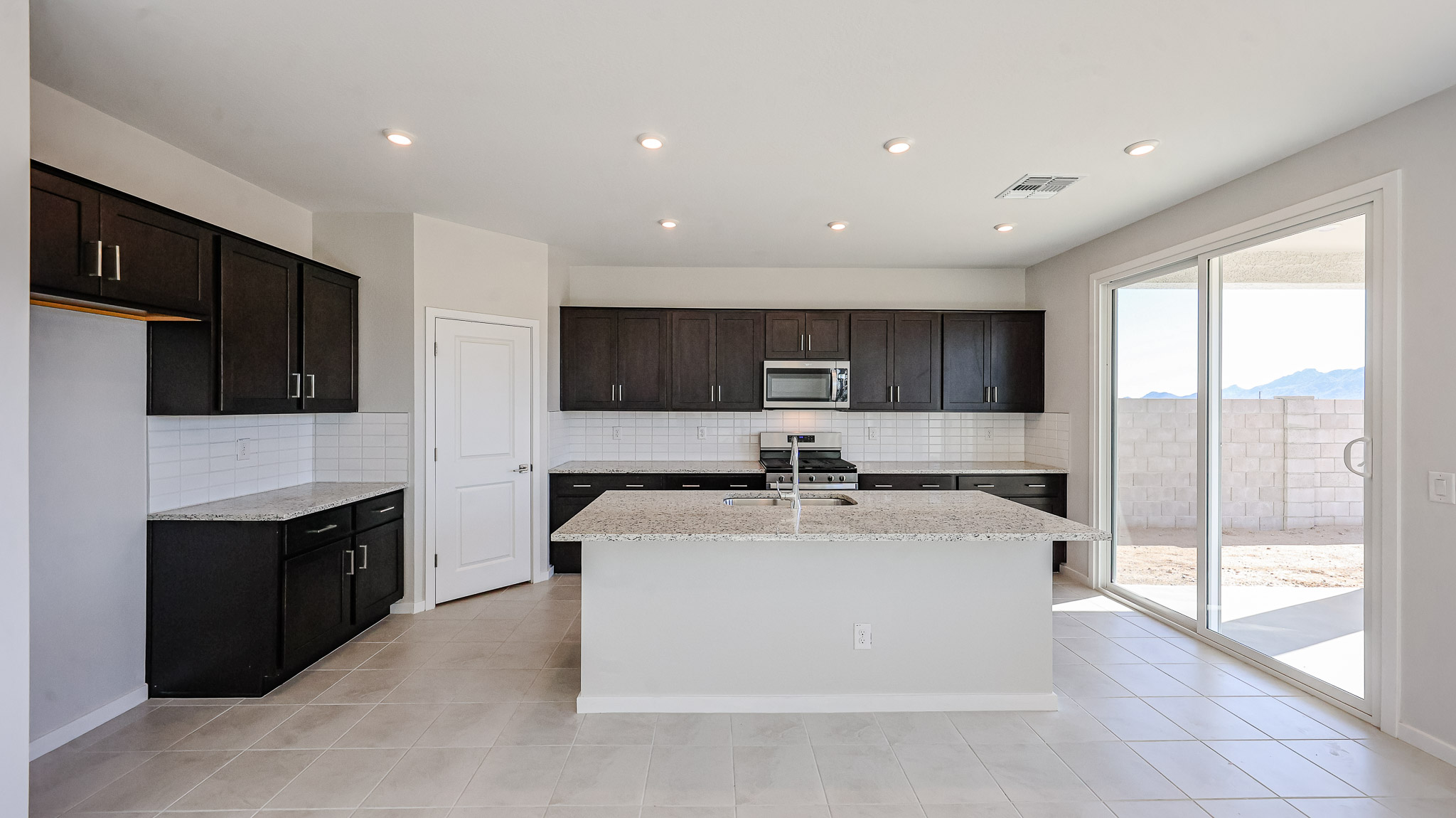 A kitchen with a large island.