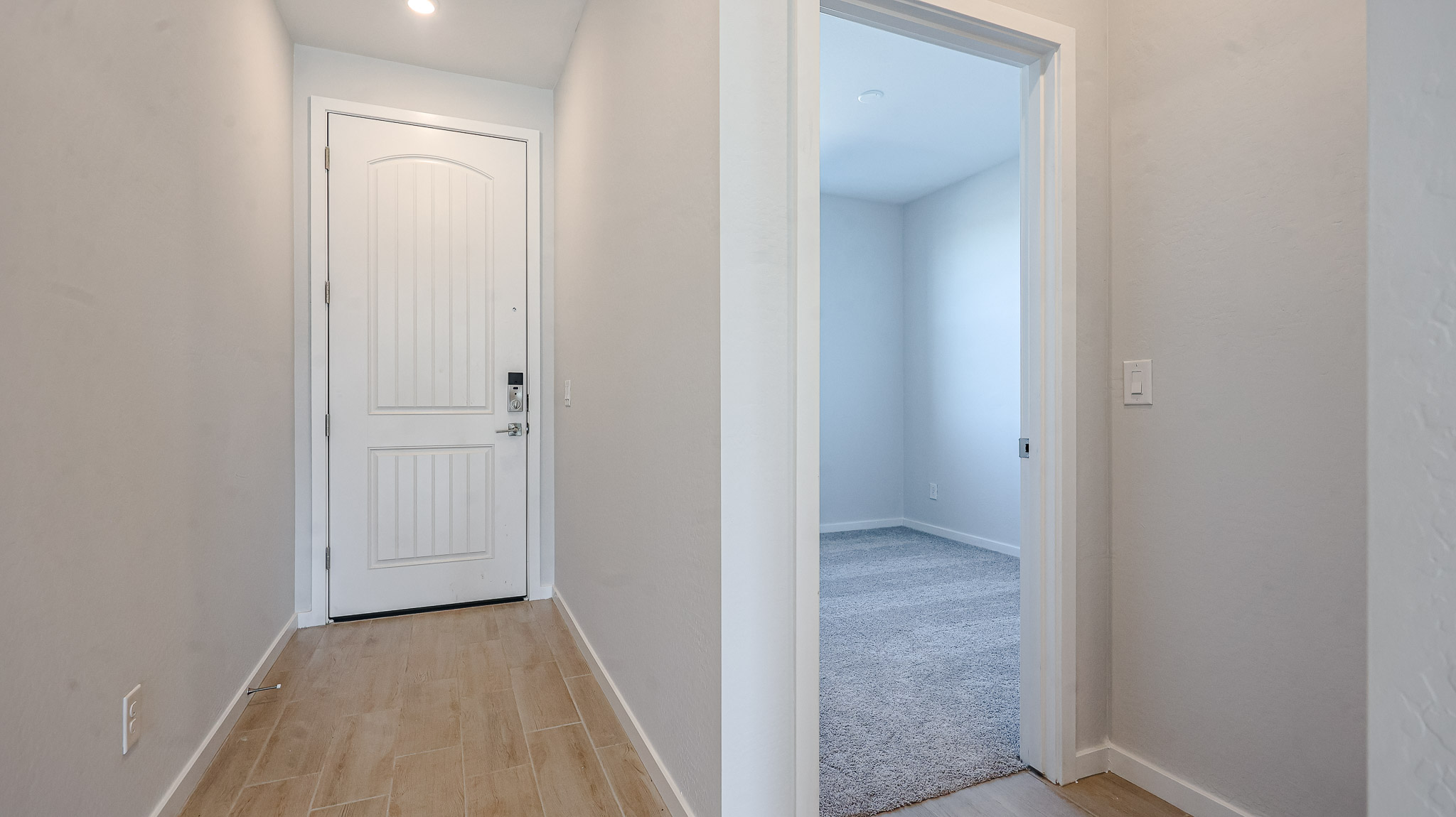 A hallway with white walls.
