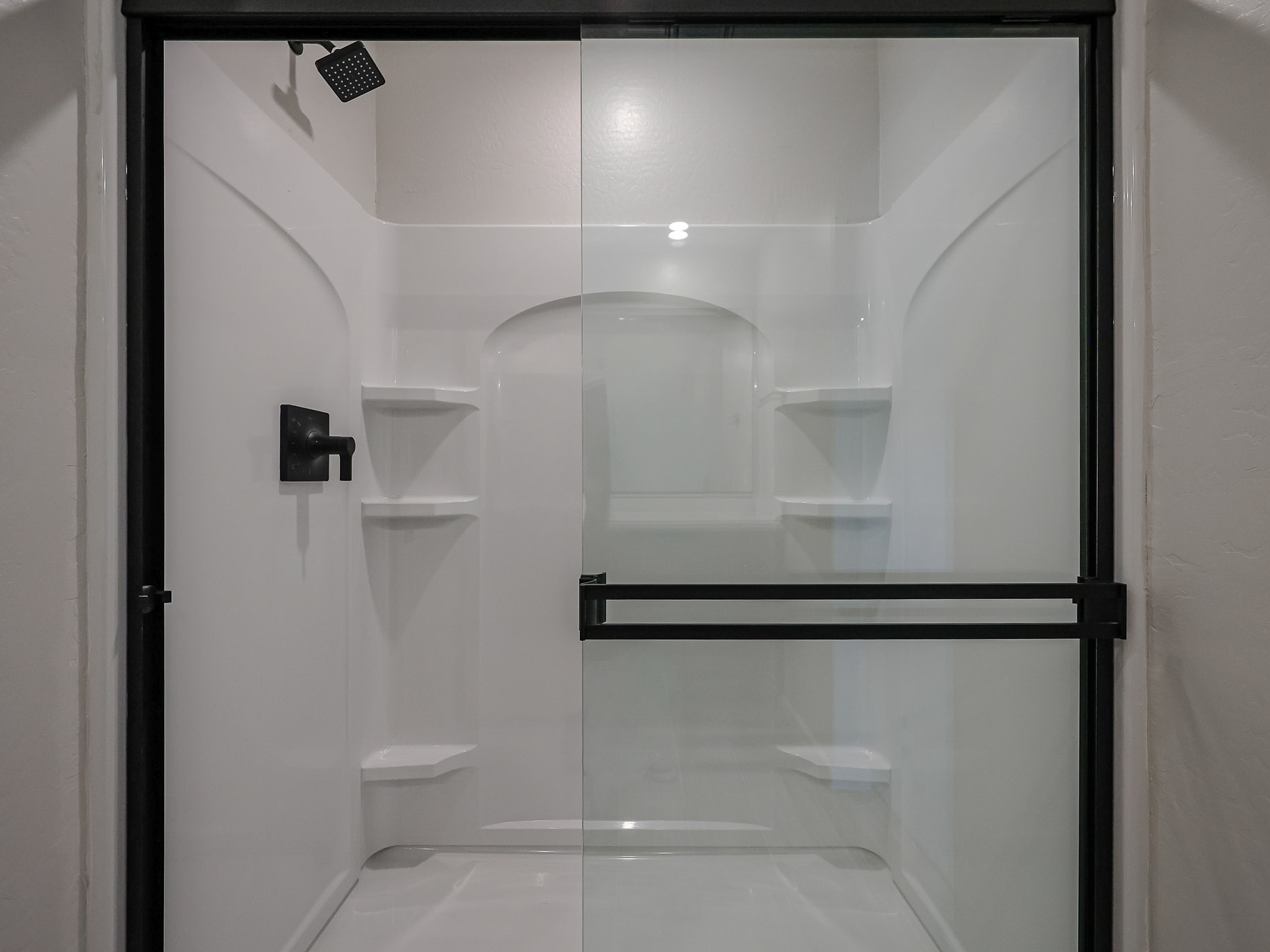 A bathroom with a glass shower.