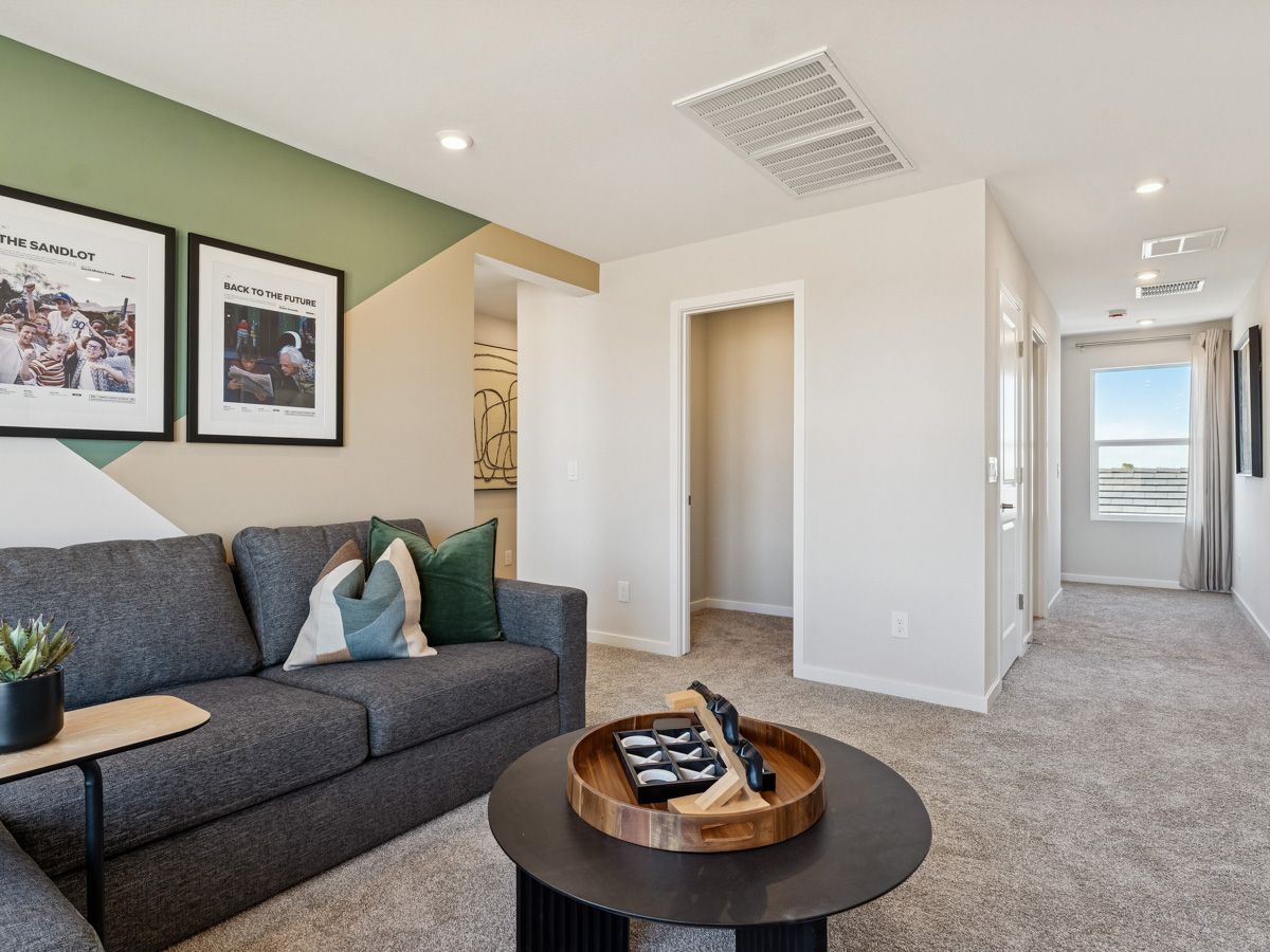 A living room with a couch and coffee table.