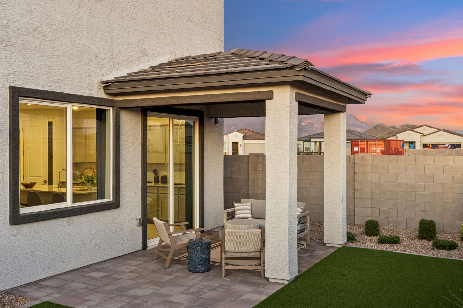 A house with a patio and a patio with a view of the mountains.