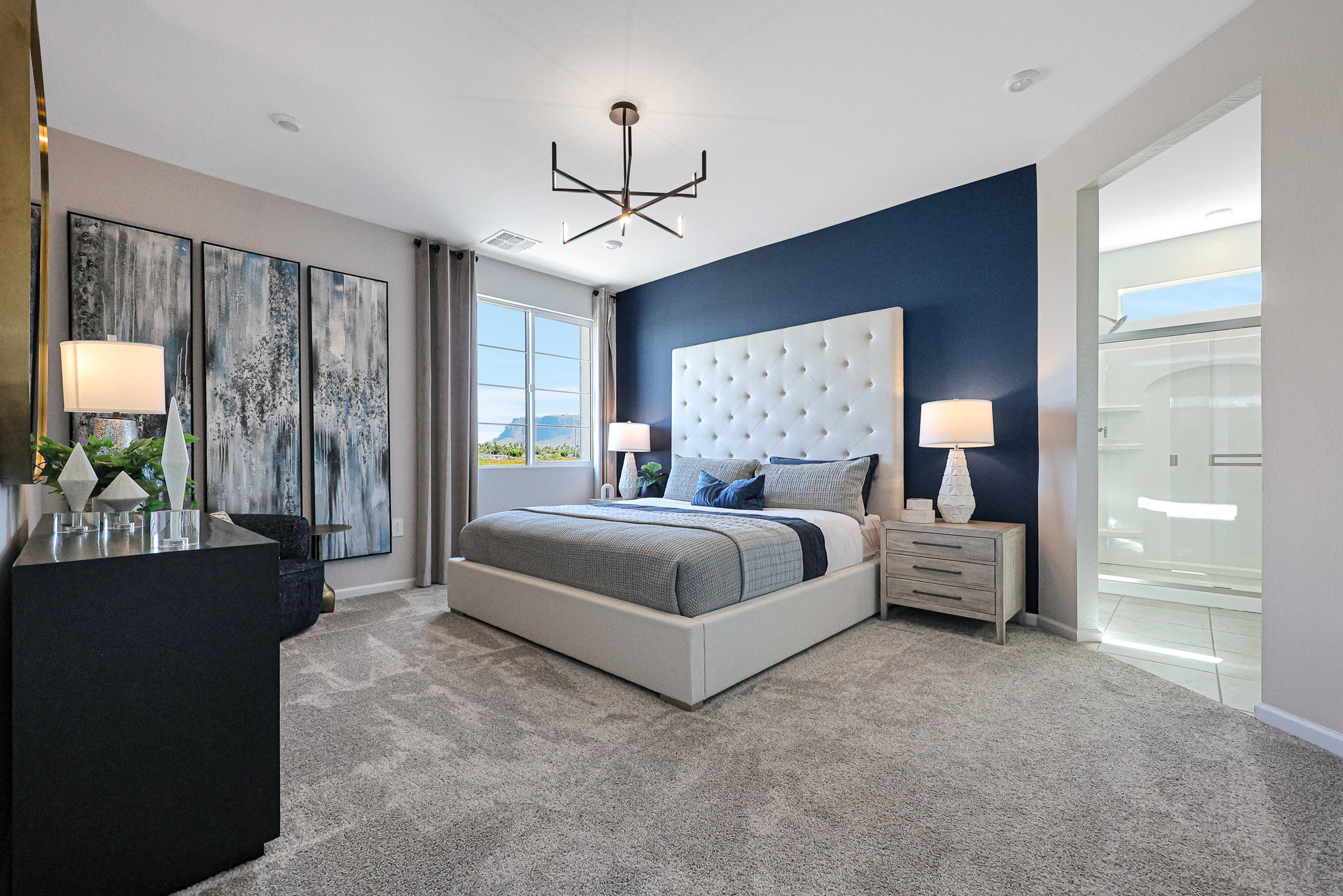 A bedroom with a large bed.