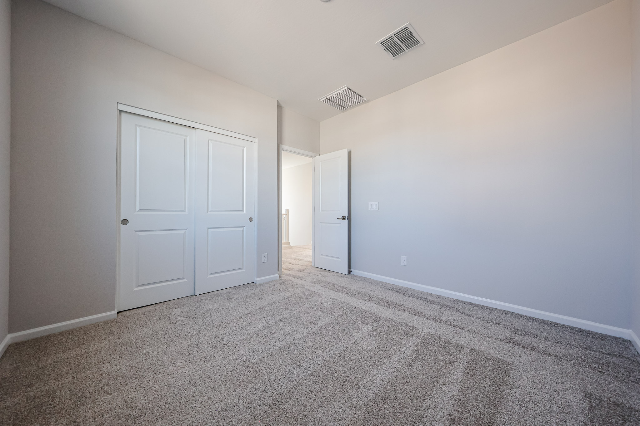 A room with white doors.