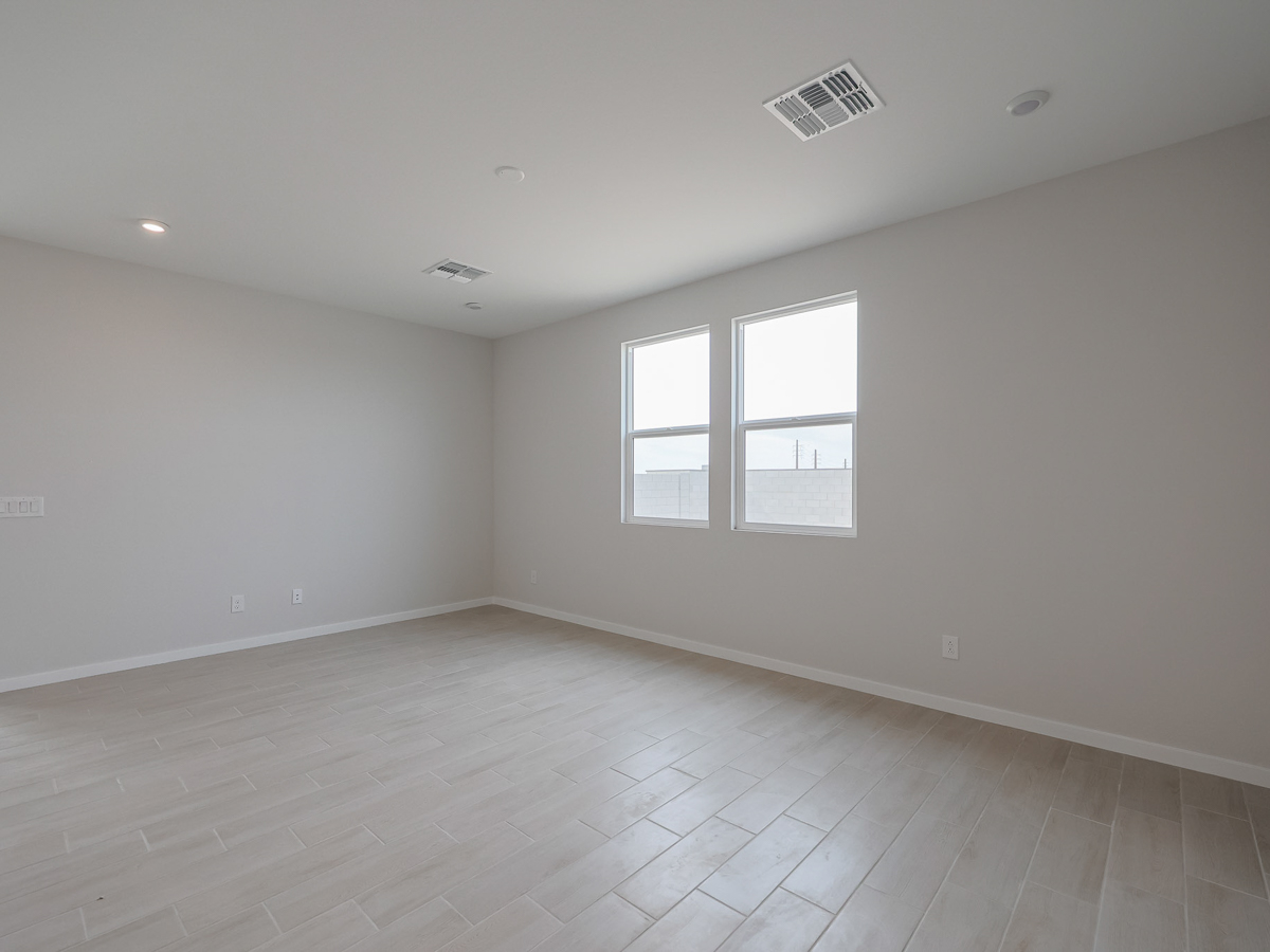 A room with a tile floor and windows.