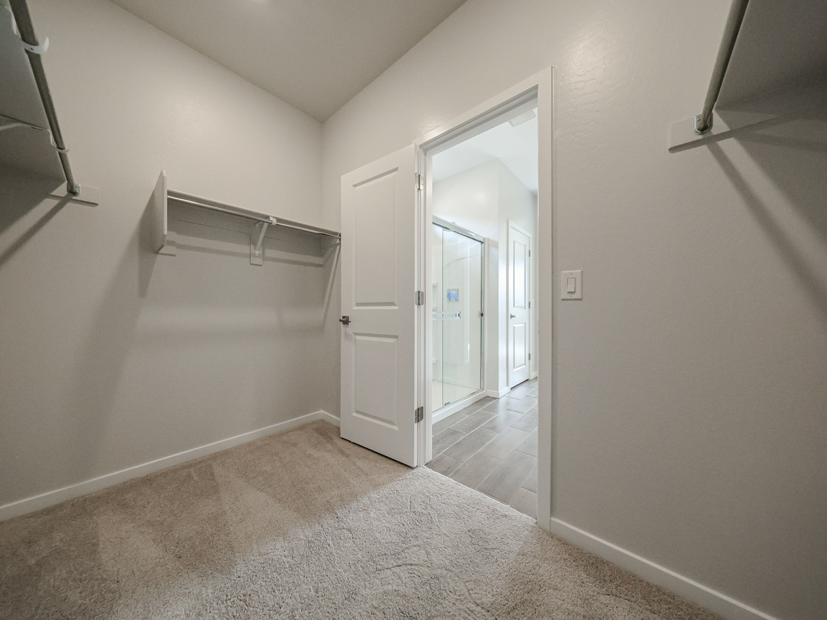 A hallway with white doors.