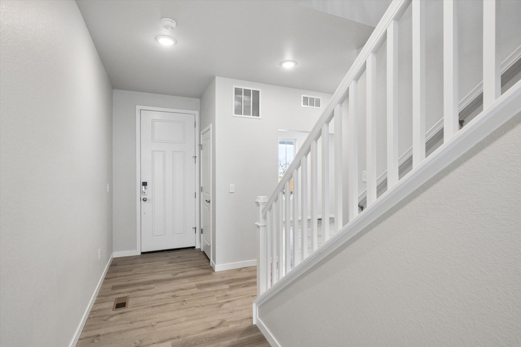 A white staircase in a house.