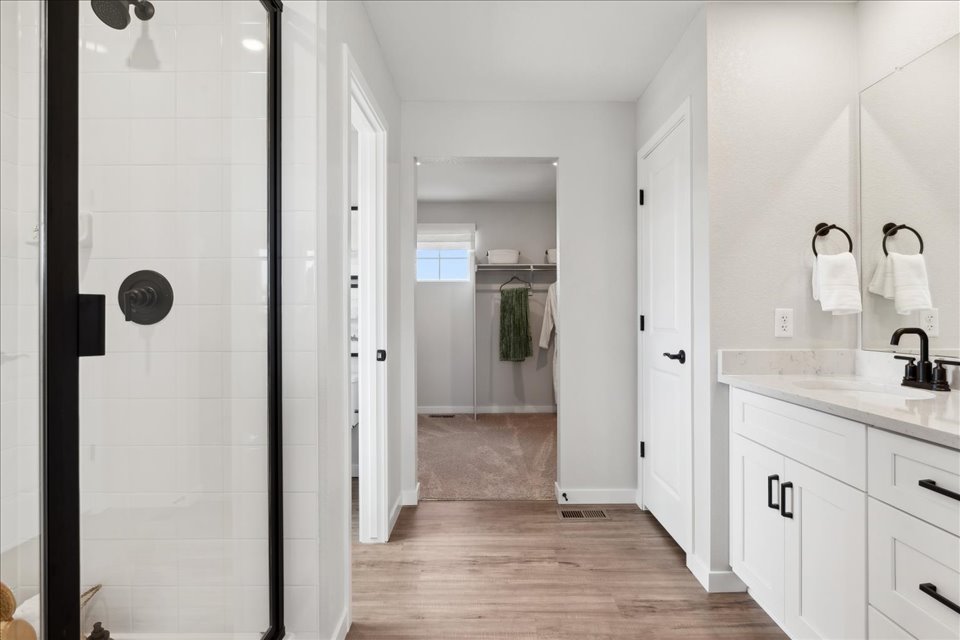 A bathroom with a glass shower.