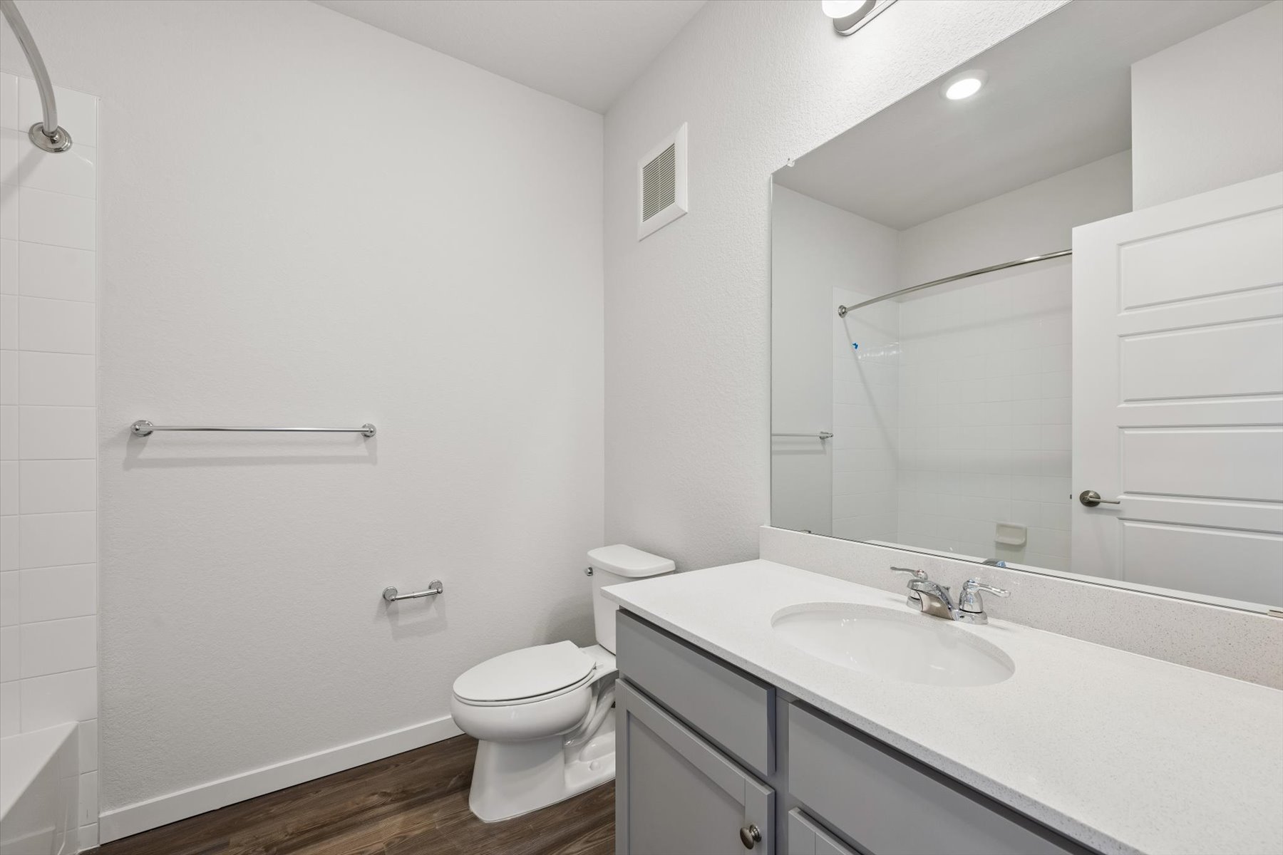 A bathroom with a sink toilet and shower.