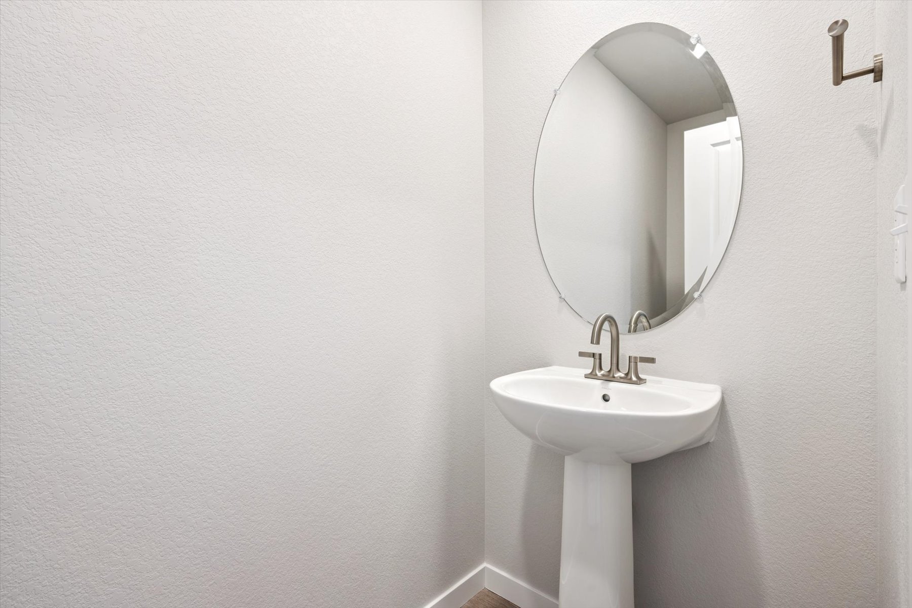 A mirror above a sink.