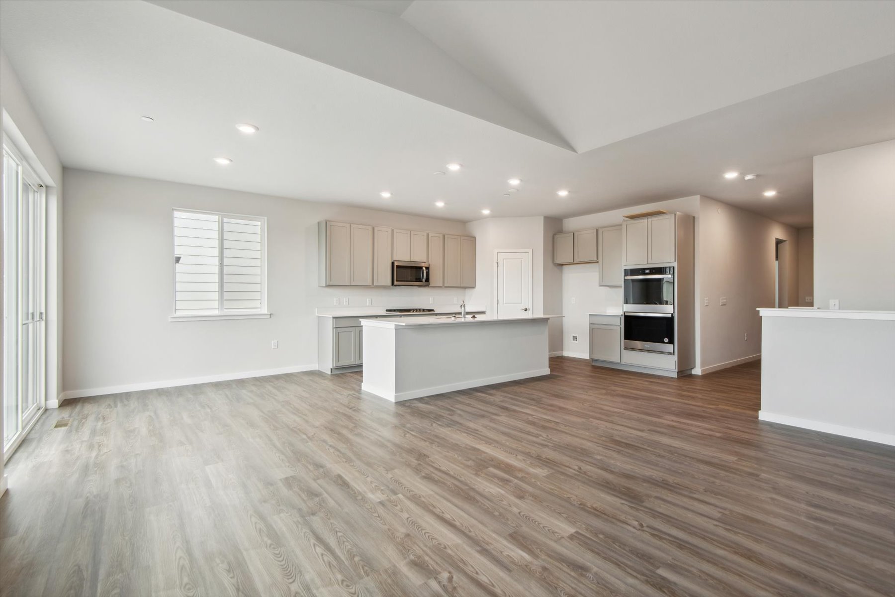A large kitchen with white cabinets.
