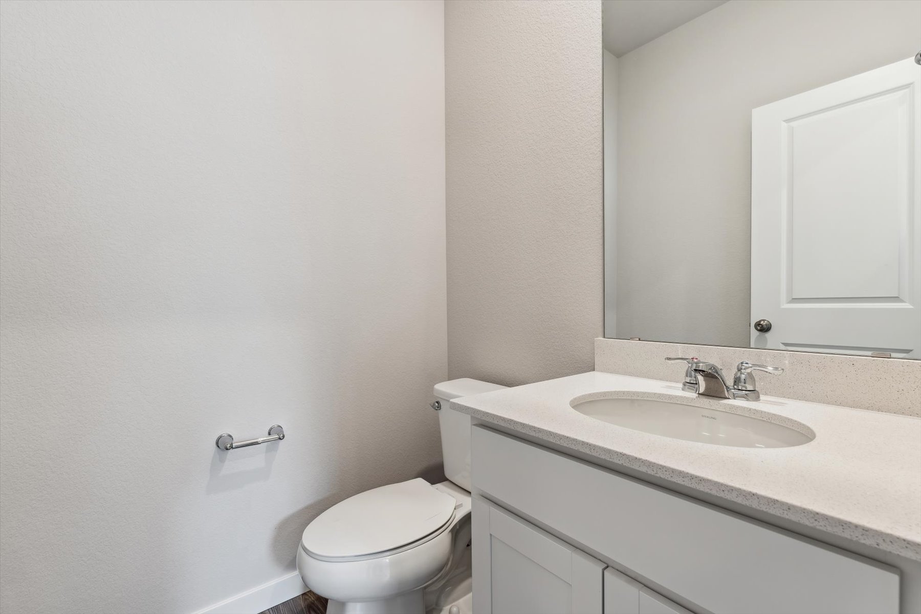 A bathroom with a sink and toilet.