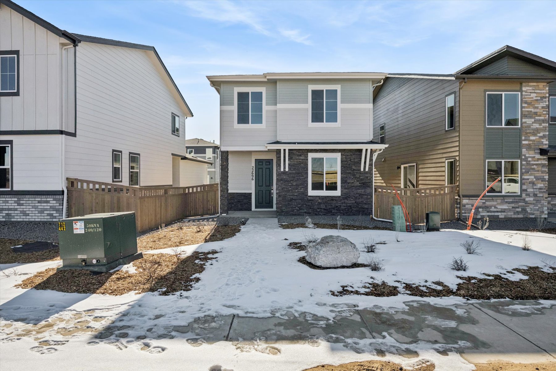 A group of houses with snow on the ground.