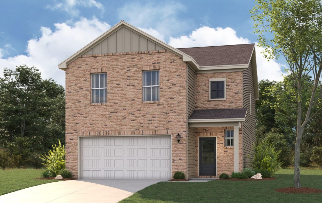 A brick house with a garage.