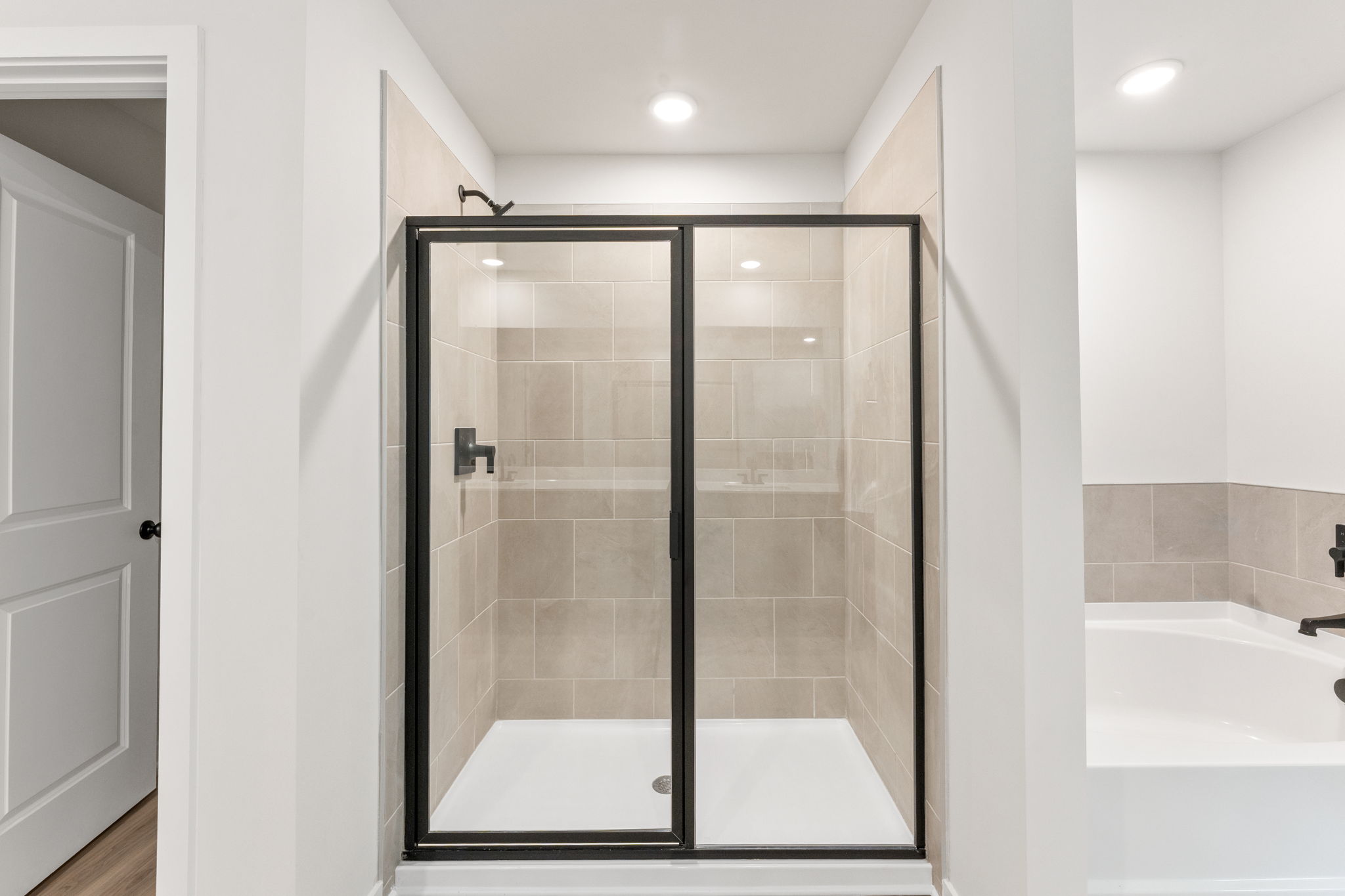 A bathroom with a glass shower.