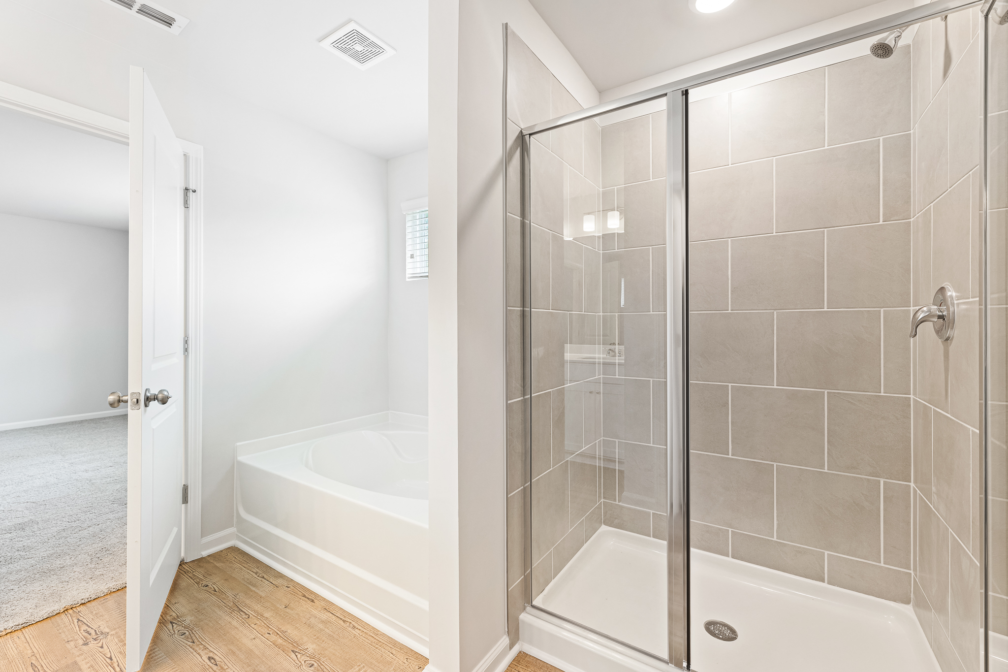 A bathroom with a glass shower.