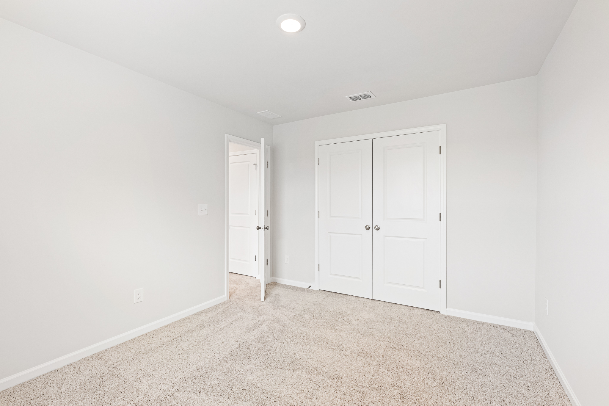 A room with white doors.