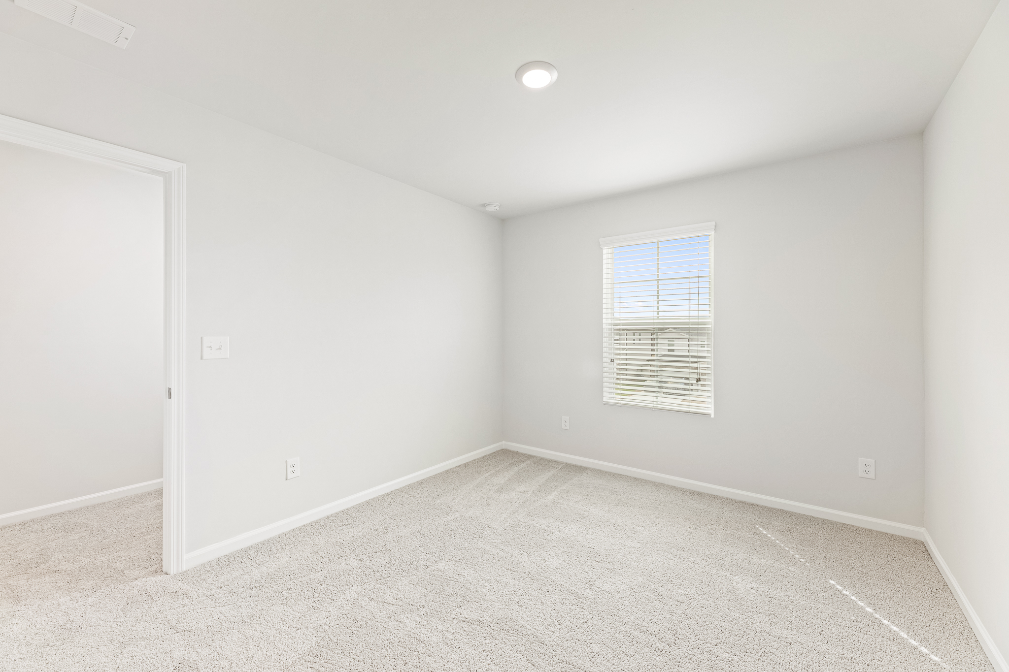 A room with a door and a window.