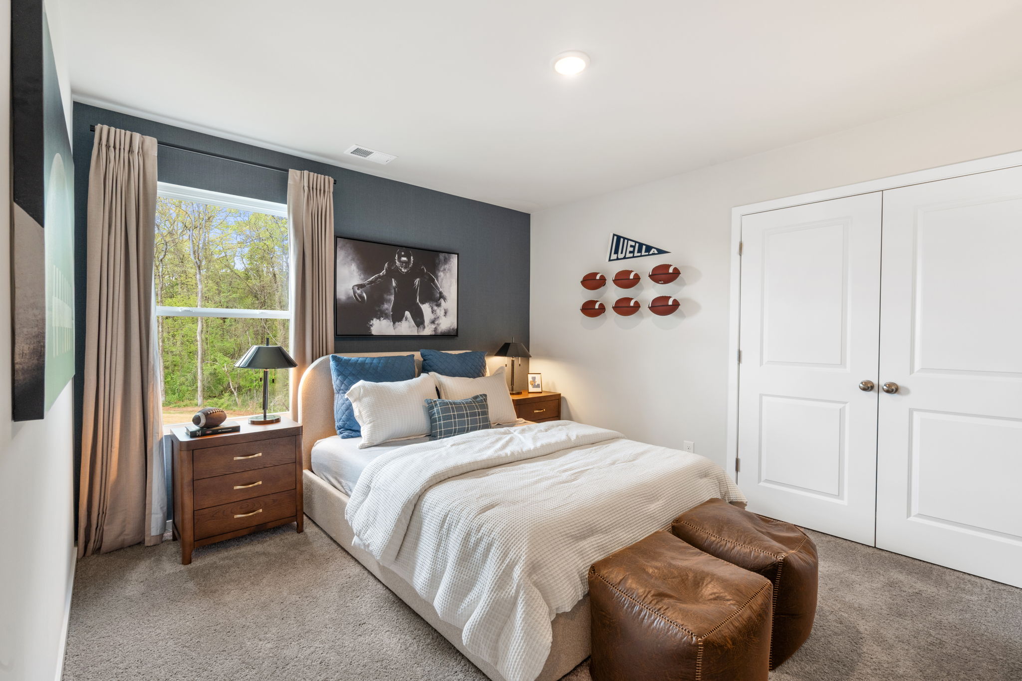 A bedroom with a bed and a couch.