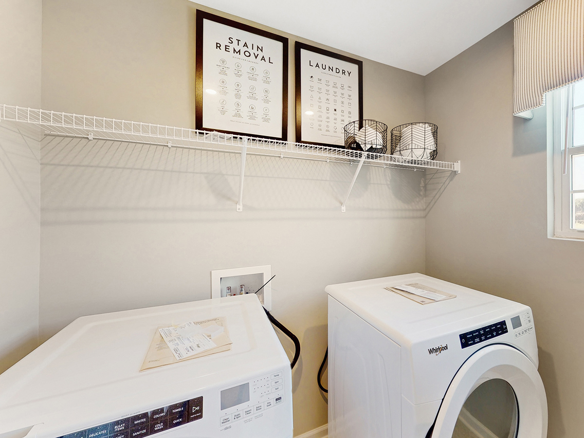 A laundry room with a washer and dryer.