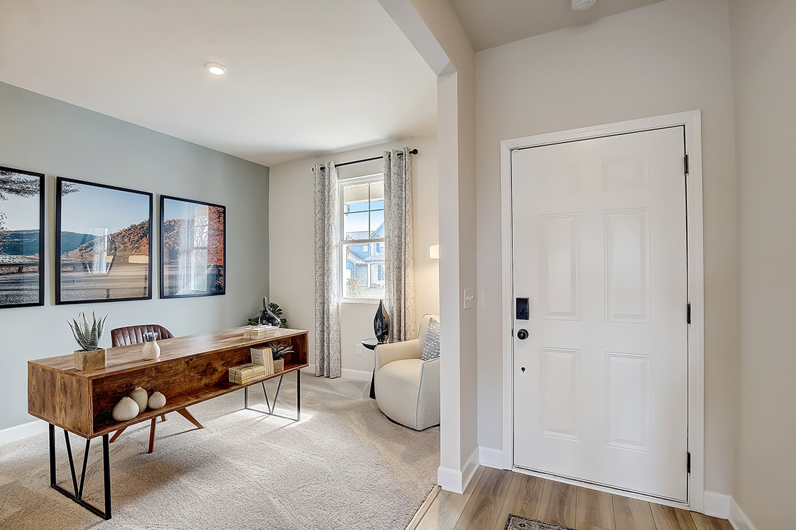 A room with a table and chairs.