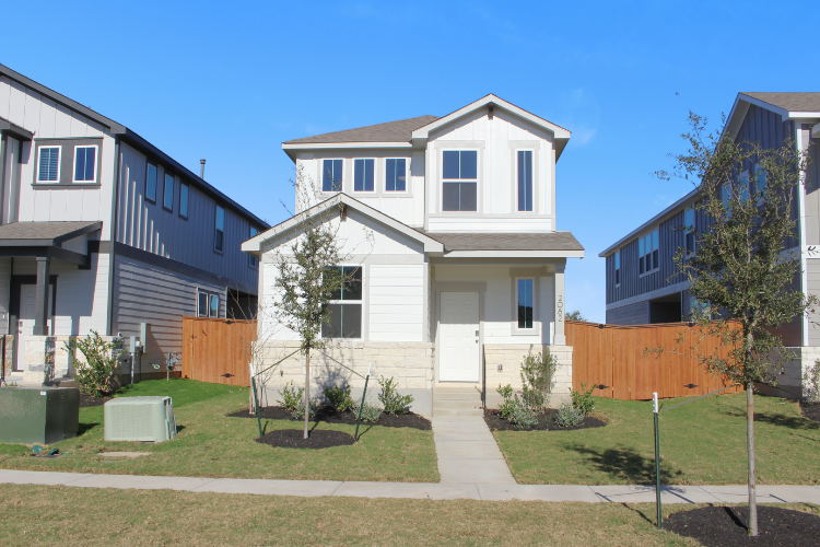 A white house with a fence.