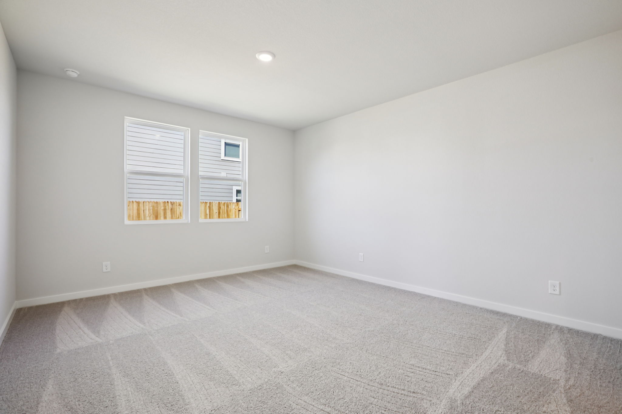A room with a white wall and a white floor.