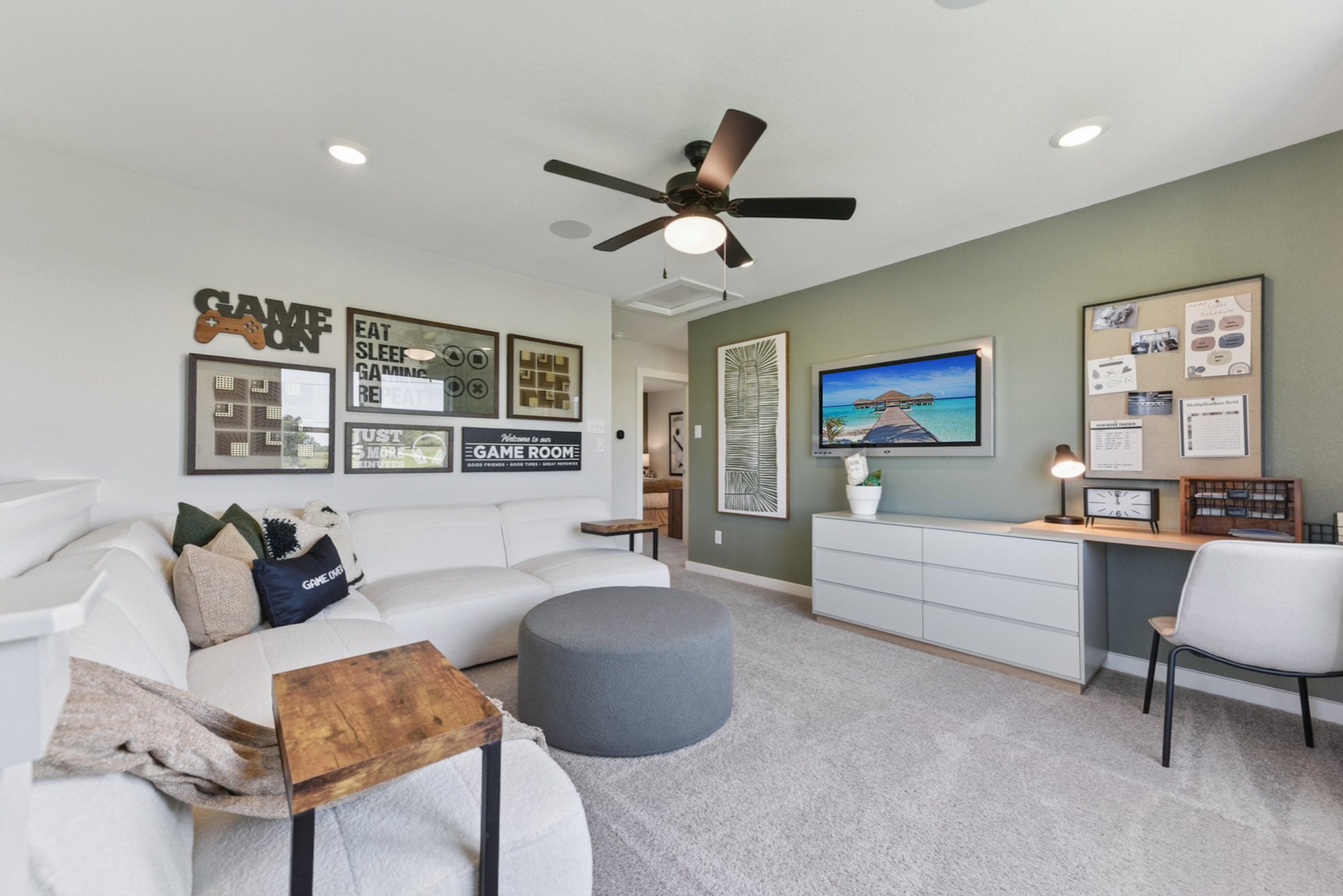 A living room with a couch and a tv.