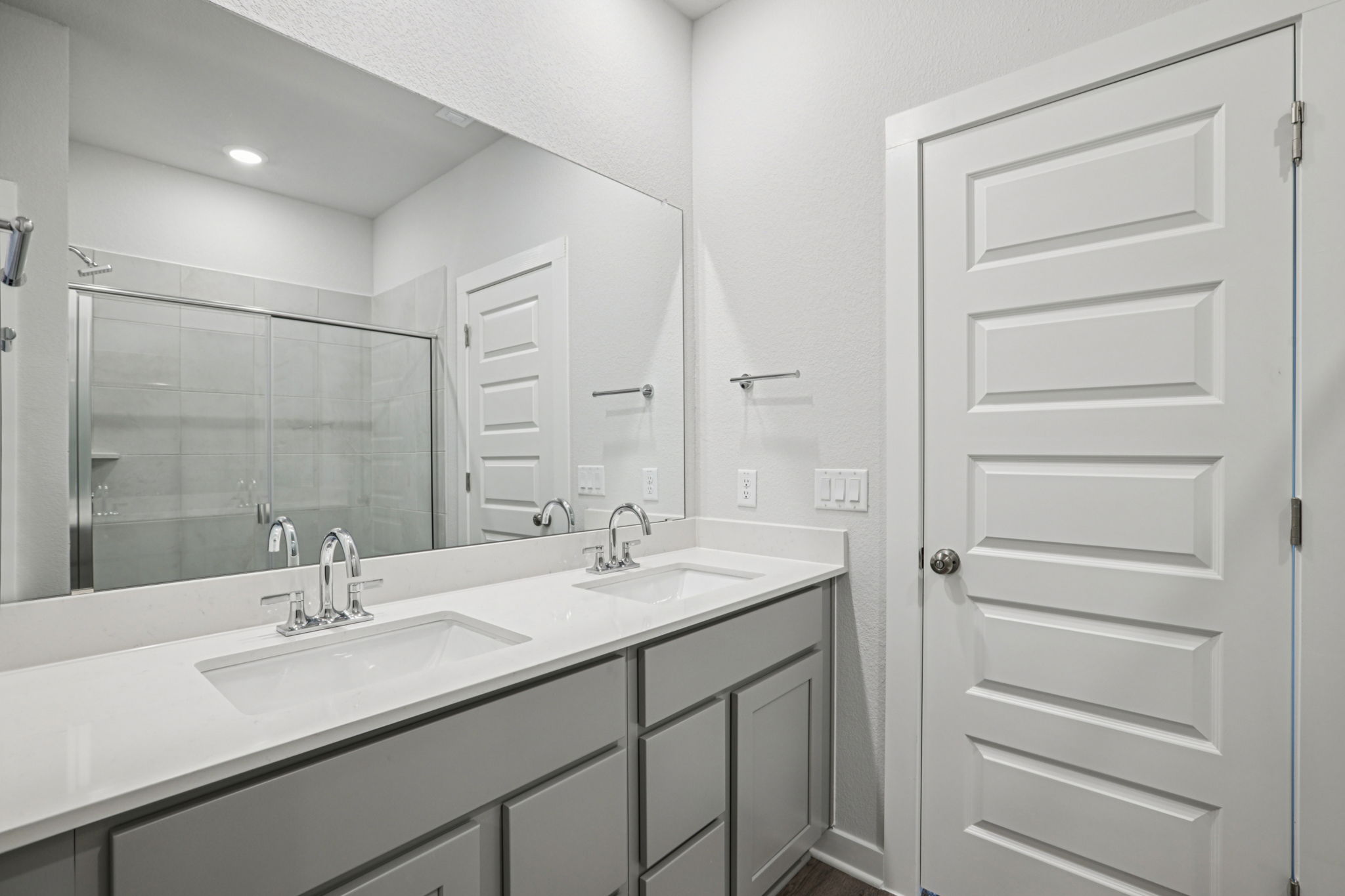 A bathroom with a glass shower.