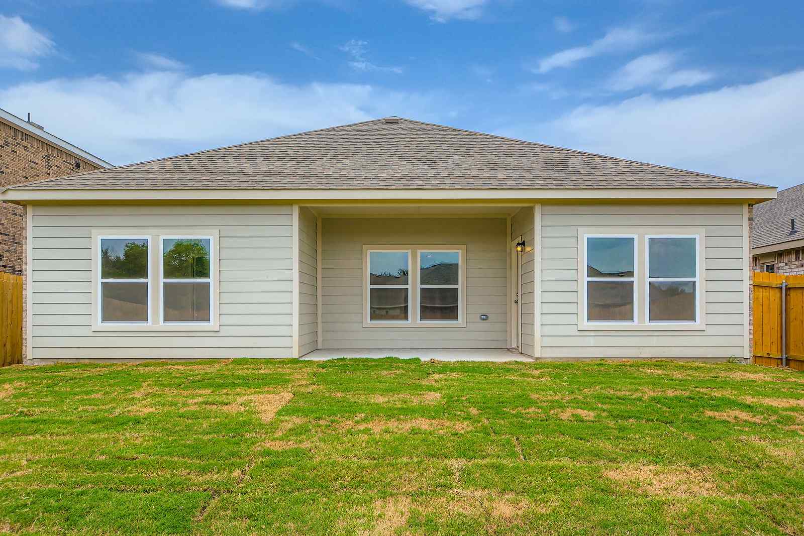 A house with a grass yard.