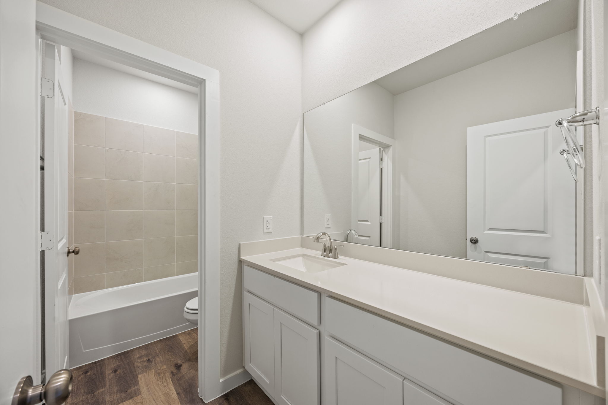 A bathroom with a glass shower.