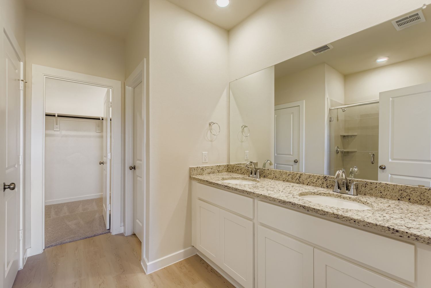 A bathroom with a marble countertop.