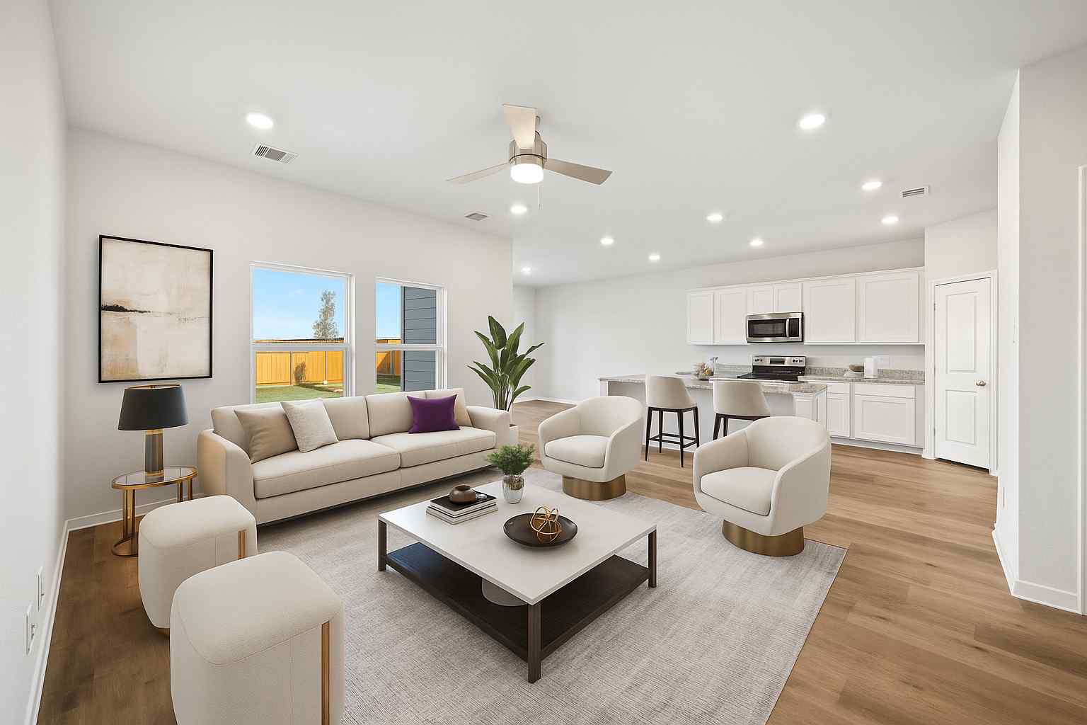 A large living room with a large white and black couch.