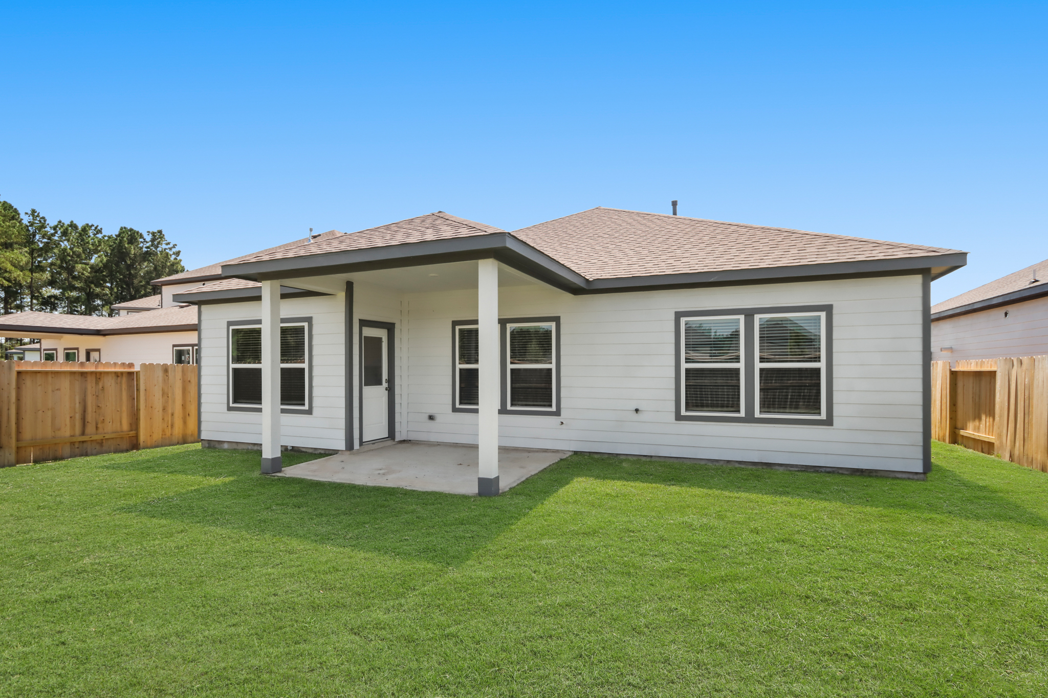 A house with a green lawn.