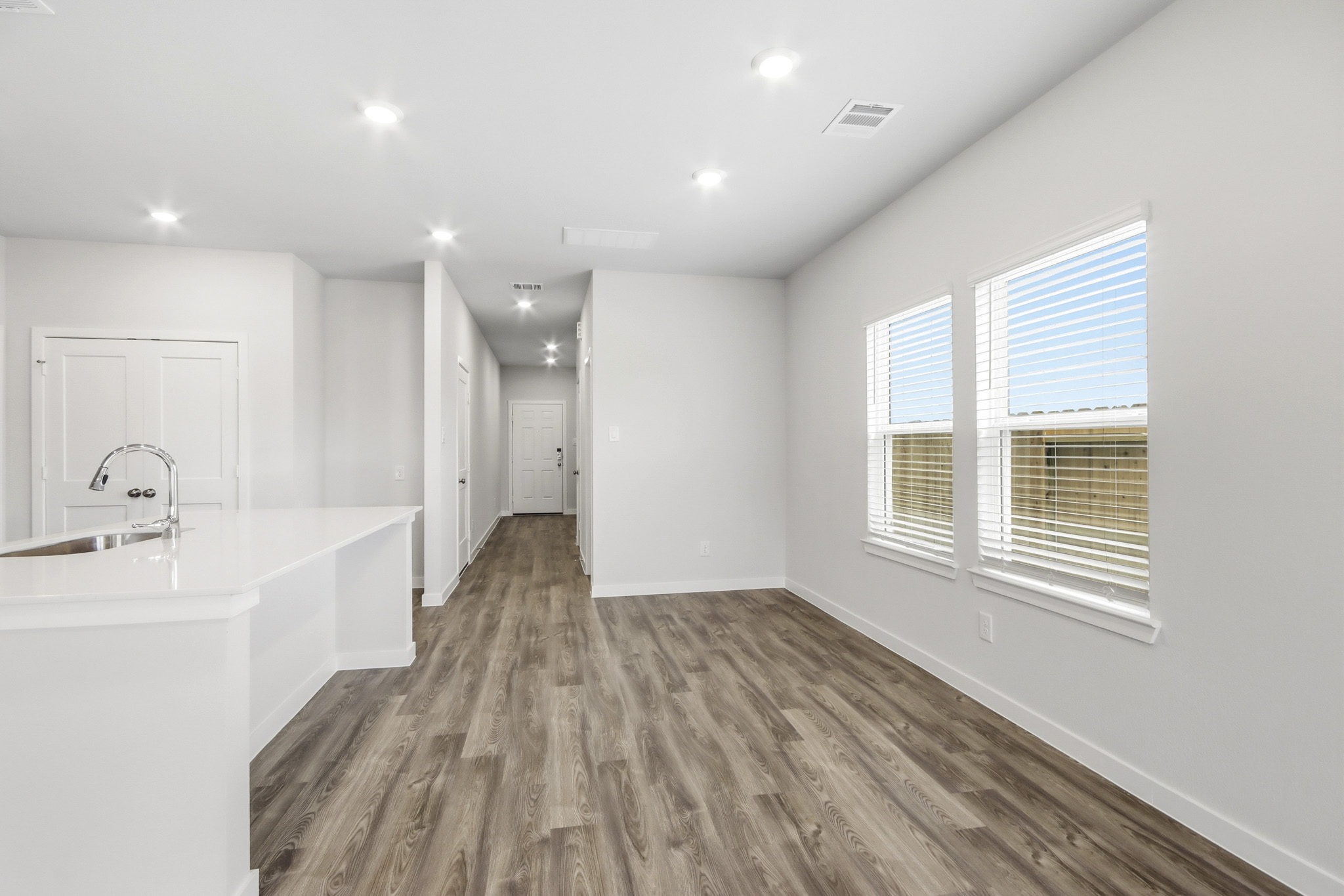 A bathroom with white walls.