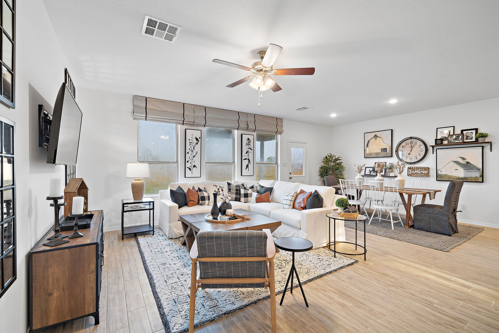 A living room with a large ceiling fan.