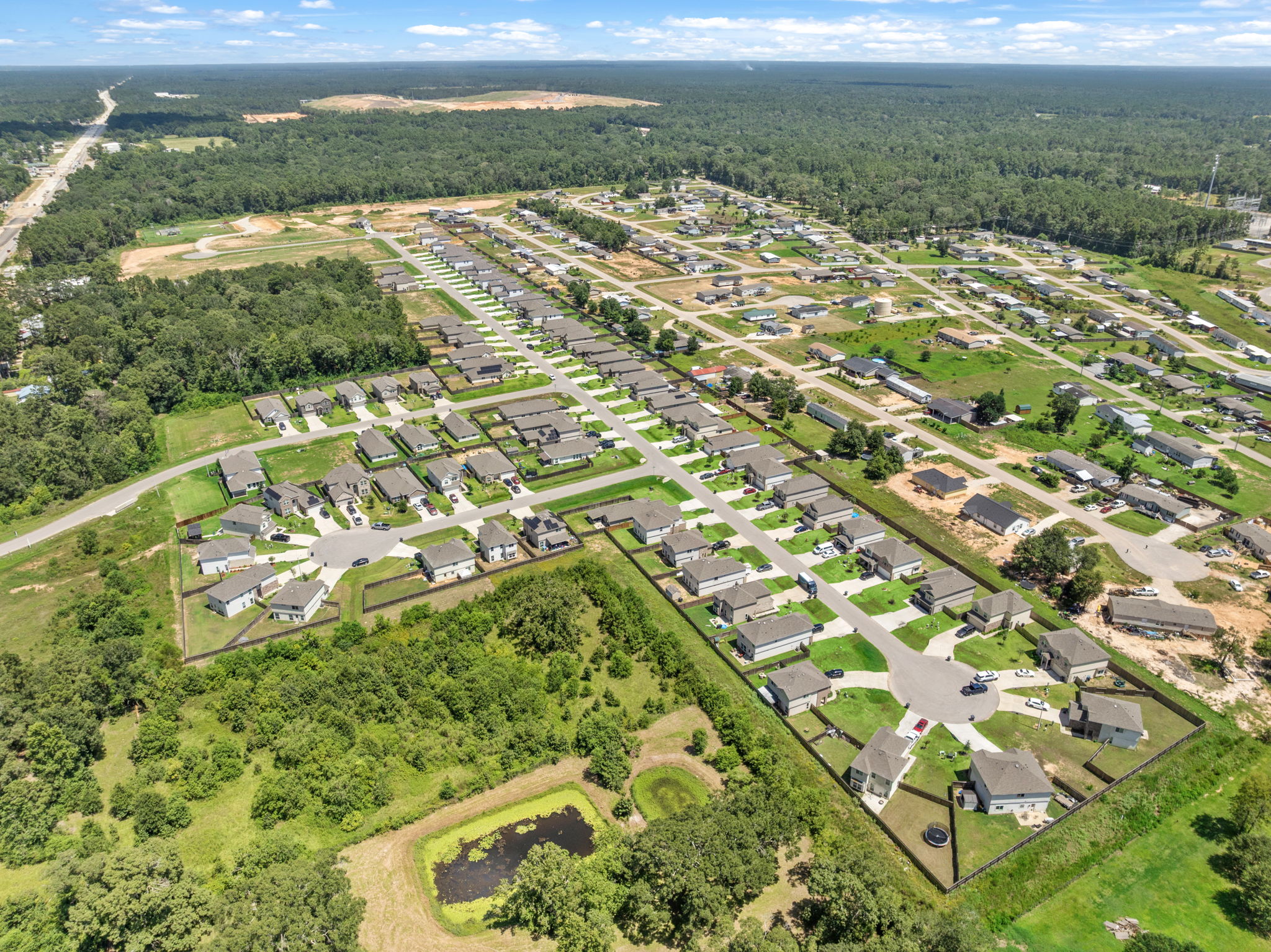A large area with many buildings and trees around it.