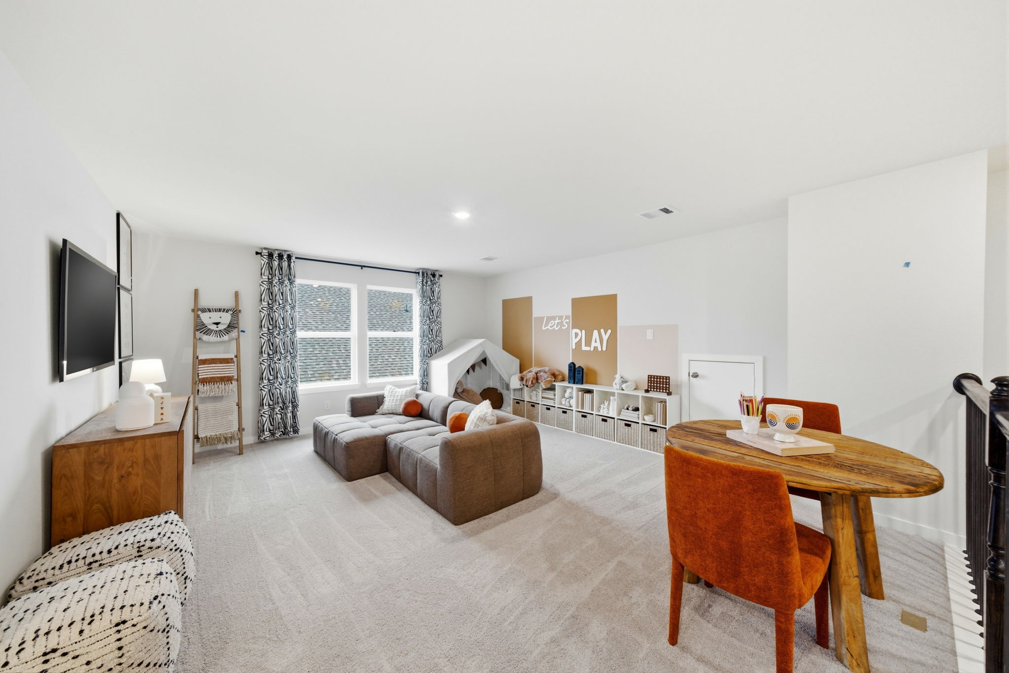 A living room with a couch and a table.