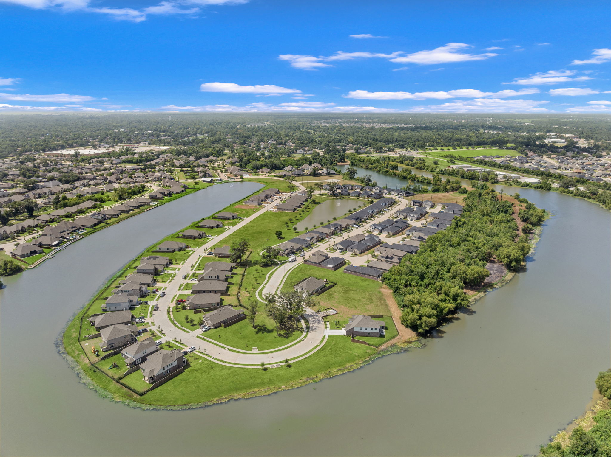 A river with a city in the background.