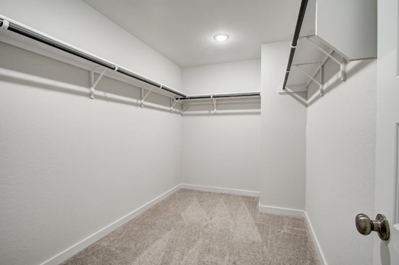 A hallway with white walls.