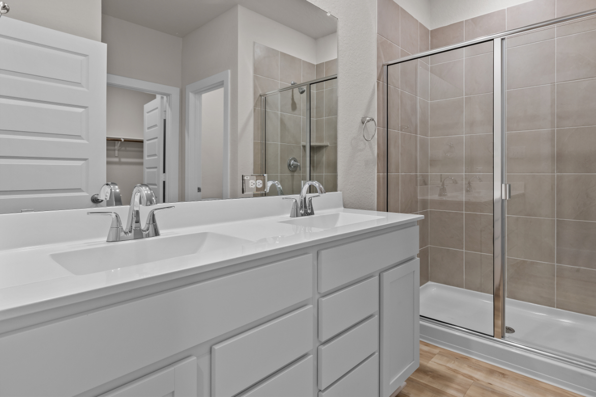 A bathroom with a glass shower.